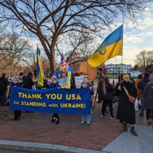 Photo of a rally / demonstration in support of Ukraine held in front of the White House. A banner reads "Thank you USA for standing with Ukraine!"